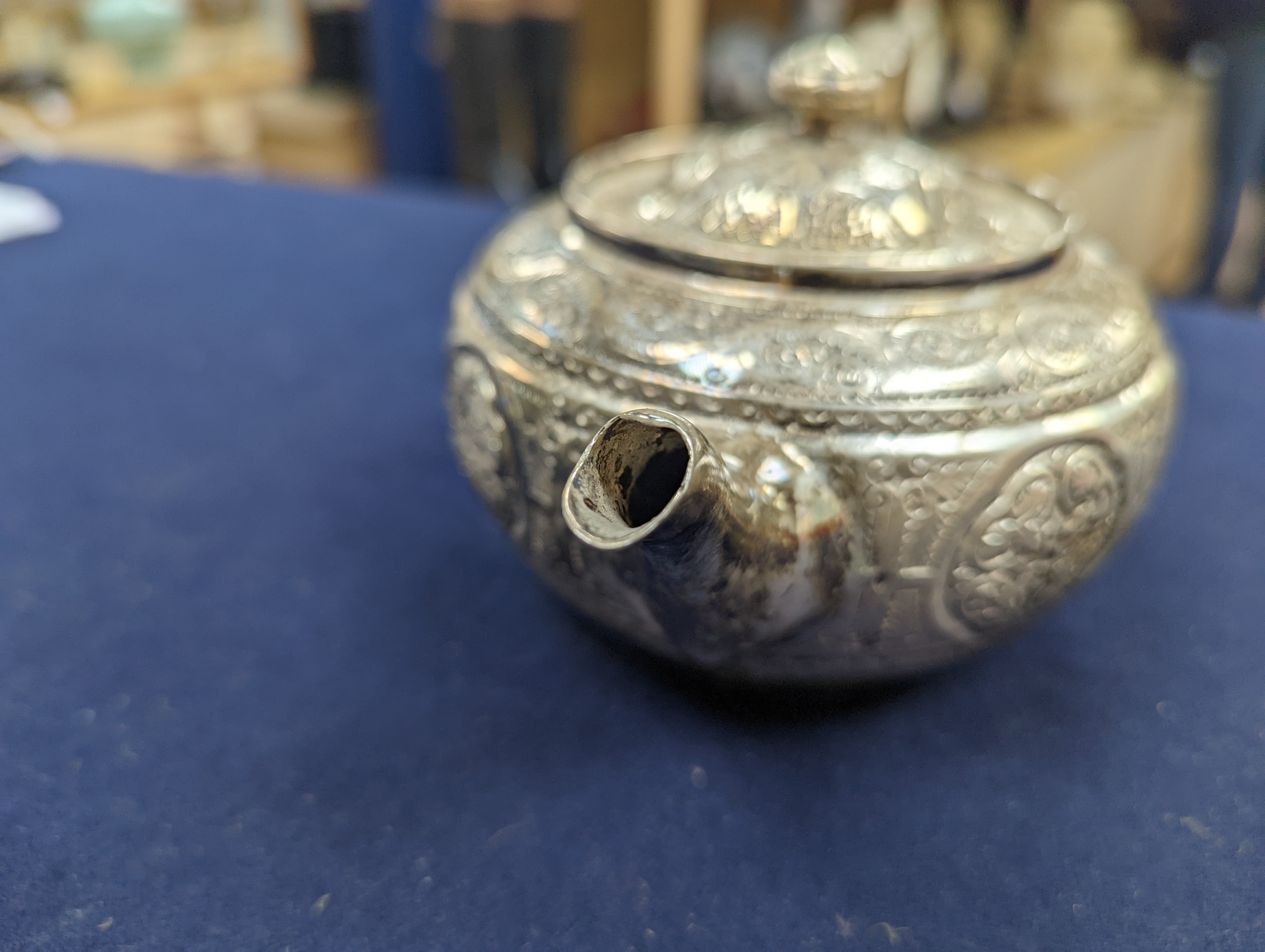 A WMF dish, Islamic white metal mounted photo album and a plated teapot and jug